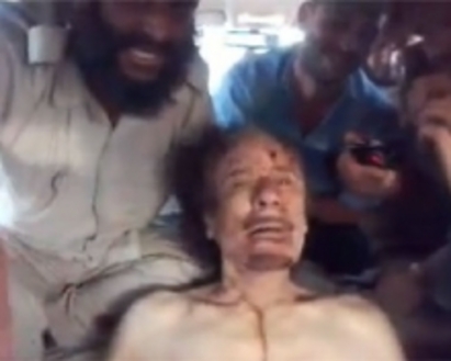 Плашат Башар Асад с ужасяващо видео на мъртвия Кадафи (ВИДЕО 18+)