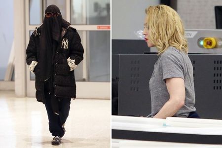 Мадона се появи с бурка на летището